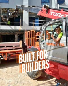 Telehandler delivering plasterboard in Adelaide – construction site logistics by Toretto Transport