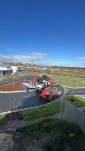 Toretto Manitou Telehandler delivering benchtops to an upper floor on an Adelaide building site